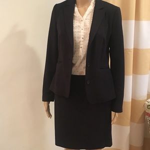 Navy blue pinstripe skirt suit